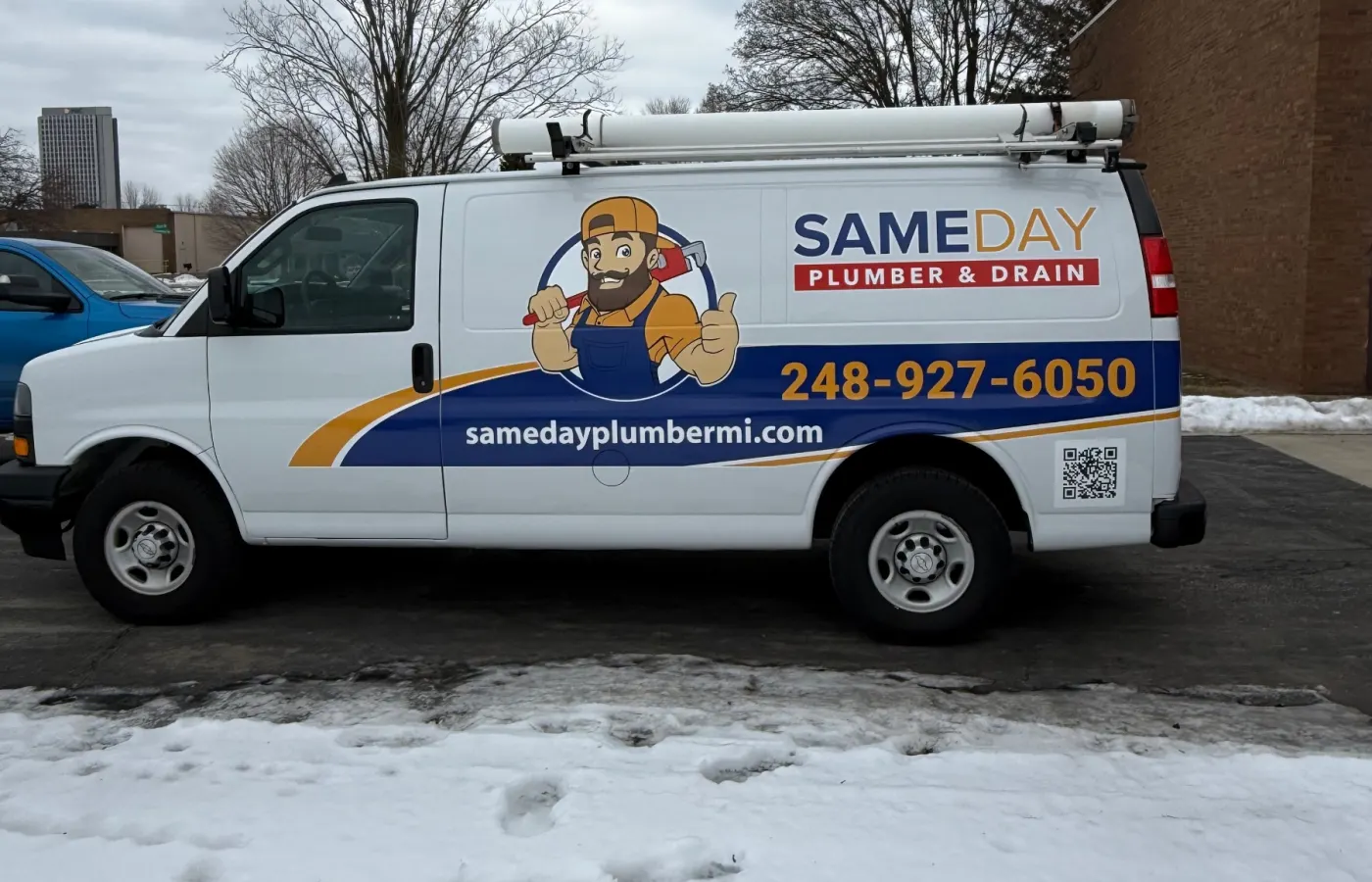 Same Day Plumber & Drain van parked on a Michigan street